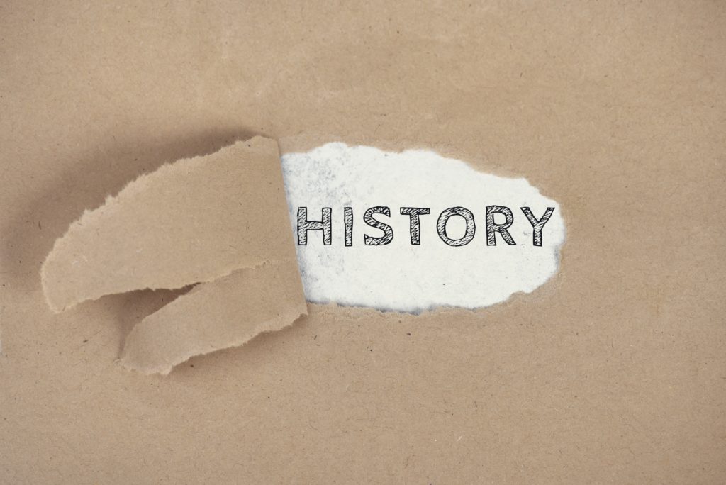 The word History on a ripped paper